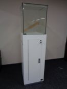 A square jeweller's shop display cabinet cupboards beneath, height 180 cm ,