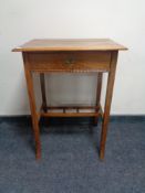 An oak Arts & Crafts work table fitted with a drawer