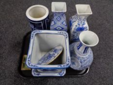 A tray of Oriental wares including blue and white planter on stand,