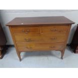 An Edwardian inlaid mahogany four drawer chest
