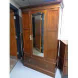 A late Victorian mirror door wardrobe