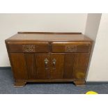 A 20th century oak sideboard