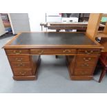 A Victorian mahogany twin pedestal desk, brass drop handles,