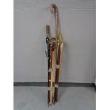 Two bundles of walking sticks, shooting sticks,