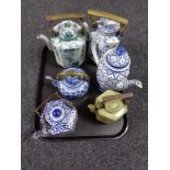 A tray of five Chinese teapots, blue and white teapot.