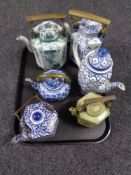 A tray of five Chinese teapots, blue and white teapot.