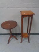 An Edwardian plant stand and a pedestal wine table