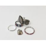 Five silver dress rings and an enamelled Blackpool fob