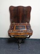 A 19th century inlaid rosewood pedestal work table