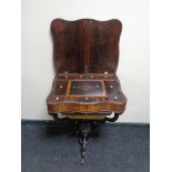 A 19th century inlaid rosewood pedestal work table