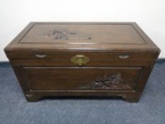 A carved camphor wood chest CONDITION REPORT: Hinges lack screws - lid loose.