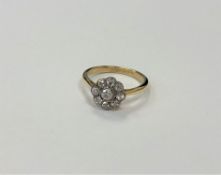 An antique 18ct gold diamond floral cluster ring