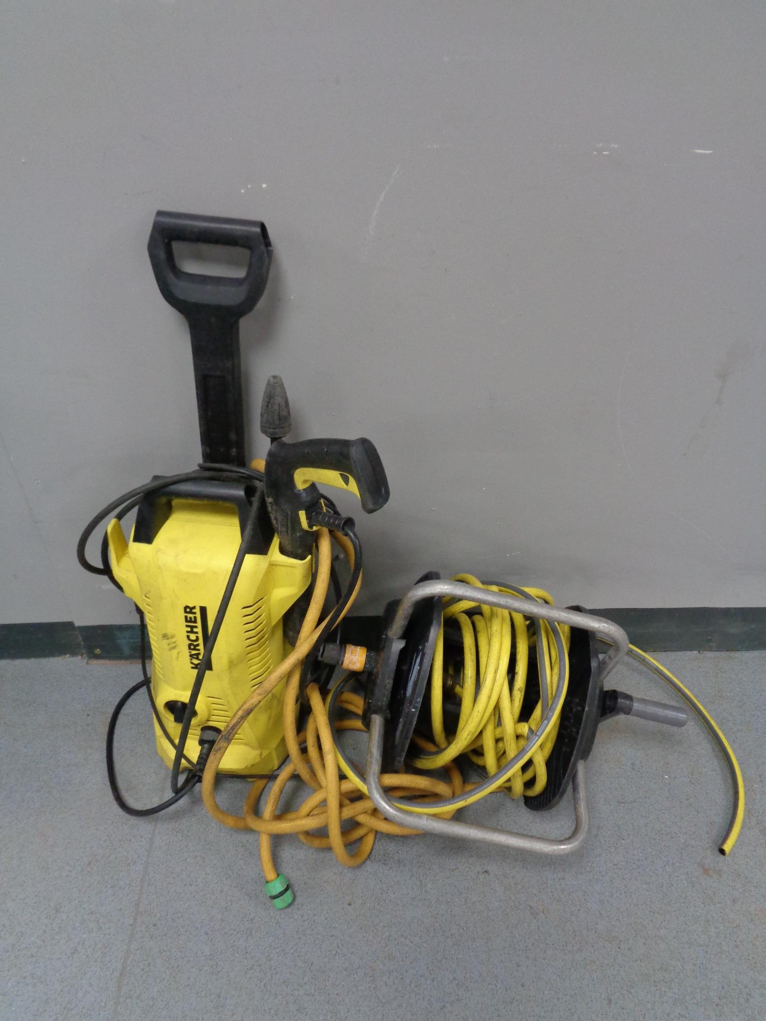 A Karcher pressure washer and a hose pipe on reel