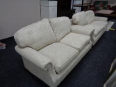 A three seater and two seater settees in beige floral fabric