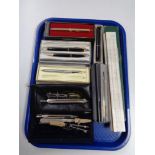 A tray of cased drawing instruments, slide rule, pens, Papermate, Parker,