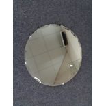 A frameless circular mirror