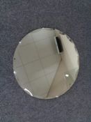 A frameless circular mirror