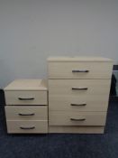 A pine effect four drawer chest and matching bedside chest