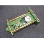 An early 20th century painted cased wall clock,