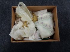 A box of table linens, doilies,