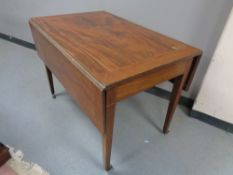 A 19th century inlaid mahogany drop leaf table