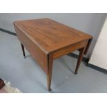 A 19th century inlaid mahogany drop leaf table