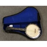 An early 20th century British banjo mandolin in case
