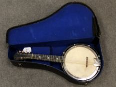 An early 20th century British banjo mandolin in case