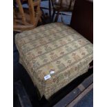 An upholstered footstool