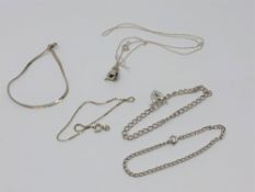 Four silver bracelets and a necklace CONDITION REPORT: 16.