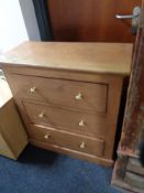 A pine three drawer chest