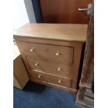 A pine three drawer chest