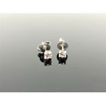 A pair of Tiffany & Co diamond stud earrings, in platinum, approximately 0.