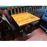 A cafe table together with a pair of wooden chairs (3)