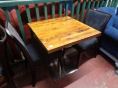 A cafe table together with a pair of wooden chairs (3)