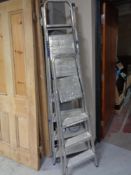 Three aluminium ladders