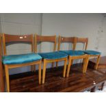 Four mid century teak dining chairs