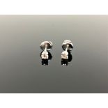 A pair of Tiffany & Co diamond stud earrings, in platinum, approximately 0.