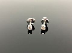 A pair of Tiffany & Co diamond stud earrings, in platinum, approximately 0.