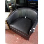 A pair of black vinyl stitched tub chairs