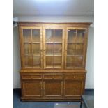 A John Lewis "Hemingway" antique style glazed three door bookcase fitted with cupboards and drawers