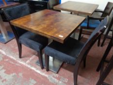 A cafe table together with a pair of wooden chairs (3)