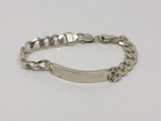 A silver identity bracelet, length 21cm CONDITION REPORT: 35.