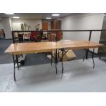 Four wooden folding trestle tables