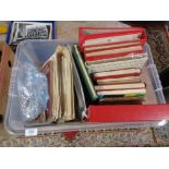 A large box of stamps and albums