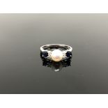 A 10ct white gold diamond sapphire and pearl ring,