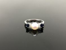 A 10ct white gold diamond sapphire and pearl ring,