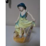 A Royal Doulton figure - Dressing up