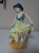 A Royal Doulton figure - Dressing up