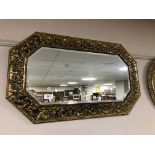 An early twentieth century brass embossed mirror